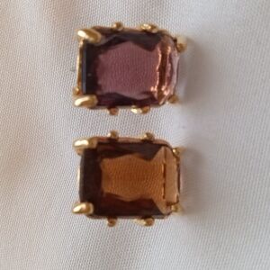 Gold Earrings with brownish purple stones.